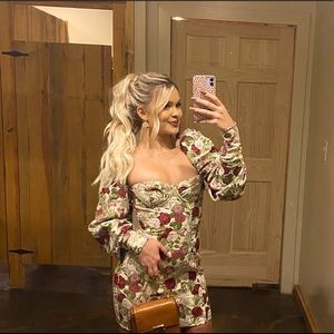 This floral, puff sleeve dress fits like a glove.